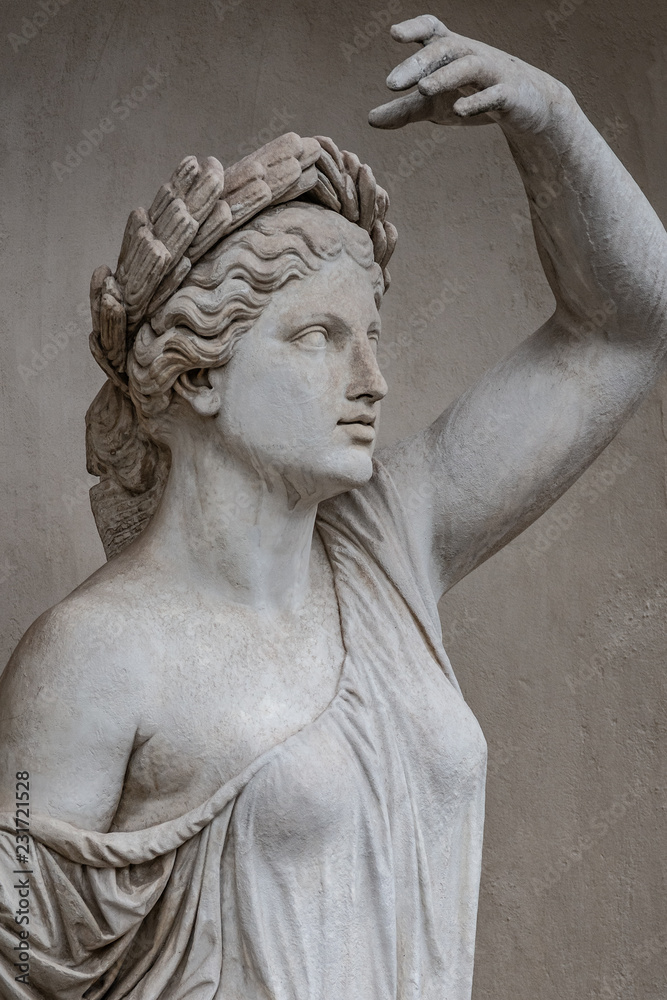 Naklejka premium Statue of sensual Roman renaissance era woman in circlet of bay leaves, Potsdam, Germany, details, closeup