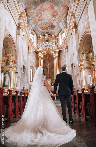 Wedding photo in the Church.Beautiful young couple