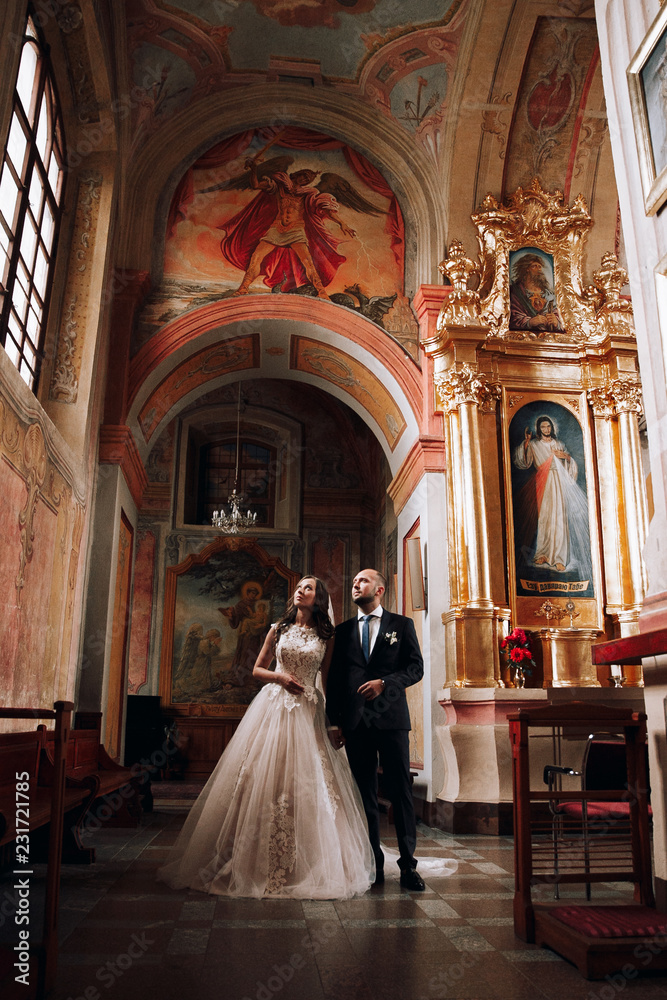 Wedding photo in the Church.Beautiful young couple