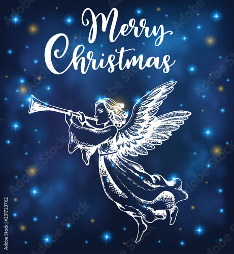 Christmas angel blows into the trumpet