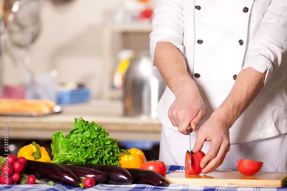 Cook cutting vegetables on the kitchen Cook cutting vegetables on the kitchen