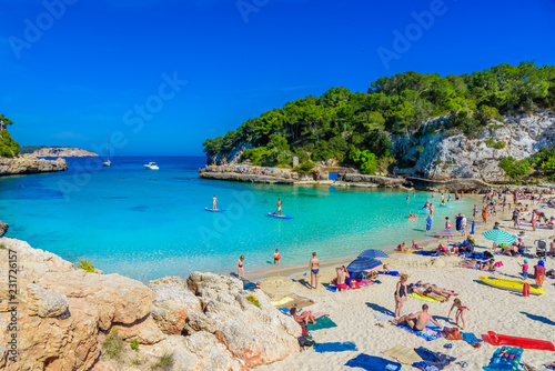 Cala Llombards beach in the summer holiday with people enjoying the vacation - Mallorca Balearic Islands in Spain