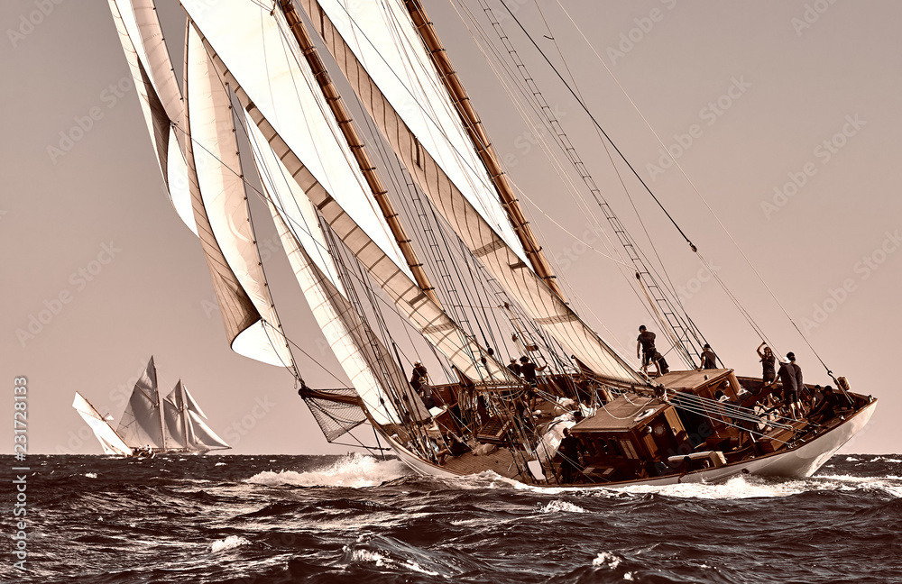 Naklejka premium Sailing ship yacht race. Yachting. Sailing. Regatta. Classic sail yachts and sailboats