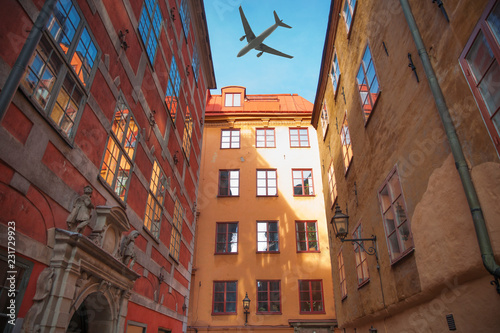 Photography plane flies over the houses of the city over Stockholm.