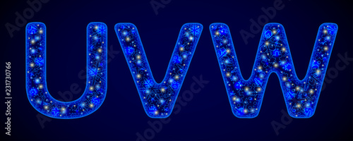 Snowy Font. Shiny letters on blue background. For festive inscriptions. UVW photo