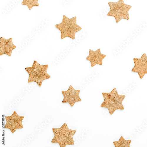 Gingerbread cookies pattern on white background. Flat lay, top view Christmas, New Year minimal food concept.