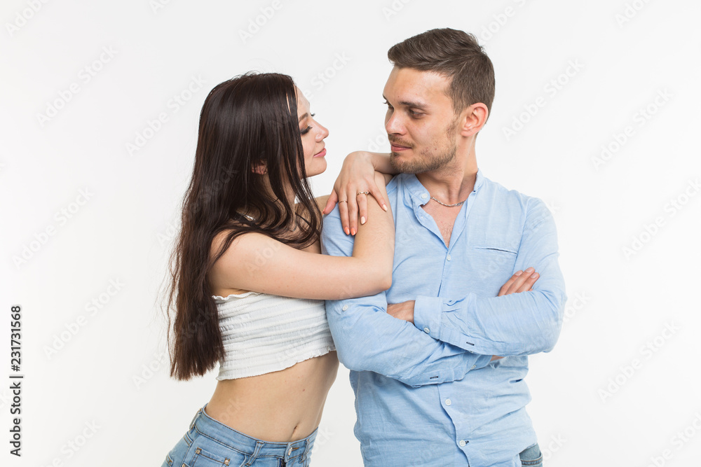 Relationship and love concept - Couple posing on white background Relationship and love concept - Couple posing on white background