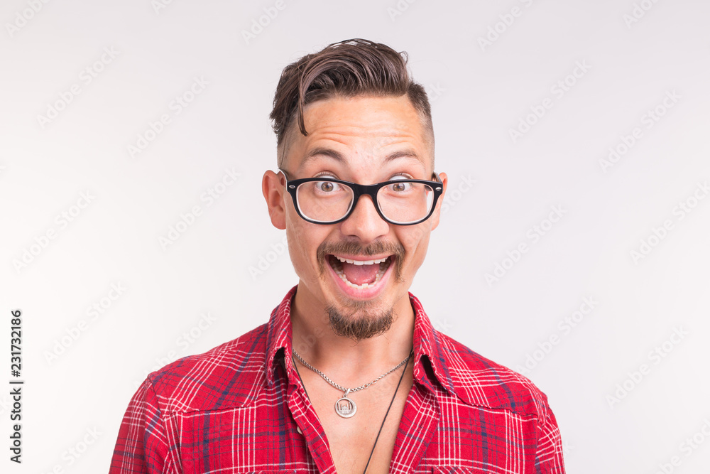 Expression and gesture concept - Handsome man with glasses laughing on white background