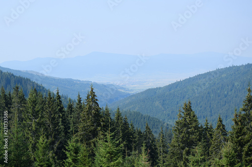Carpathians mountains in Romania. 12C road near Bicaz Canyon. Mountain meadow with lots of garbage. Transylvania, Romania.