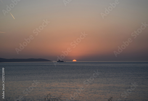 Golden hour Sundown, with view to Korfu island. Sunset on the beach in Ksamil near Saranda, Albania.