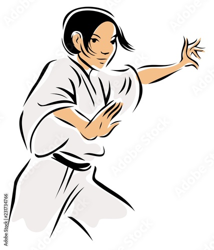 Young woman practicing martial arts, wearing a gee. 