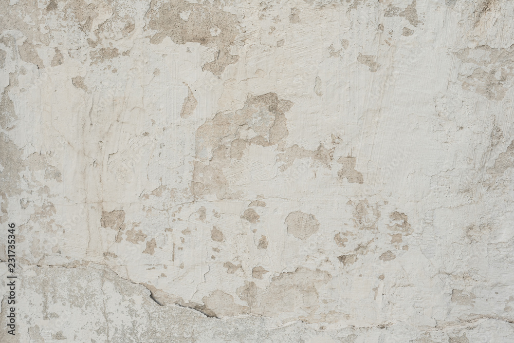 Fototapeta premium Wall fragment with scratches and cracks. It can be used as a background