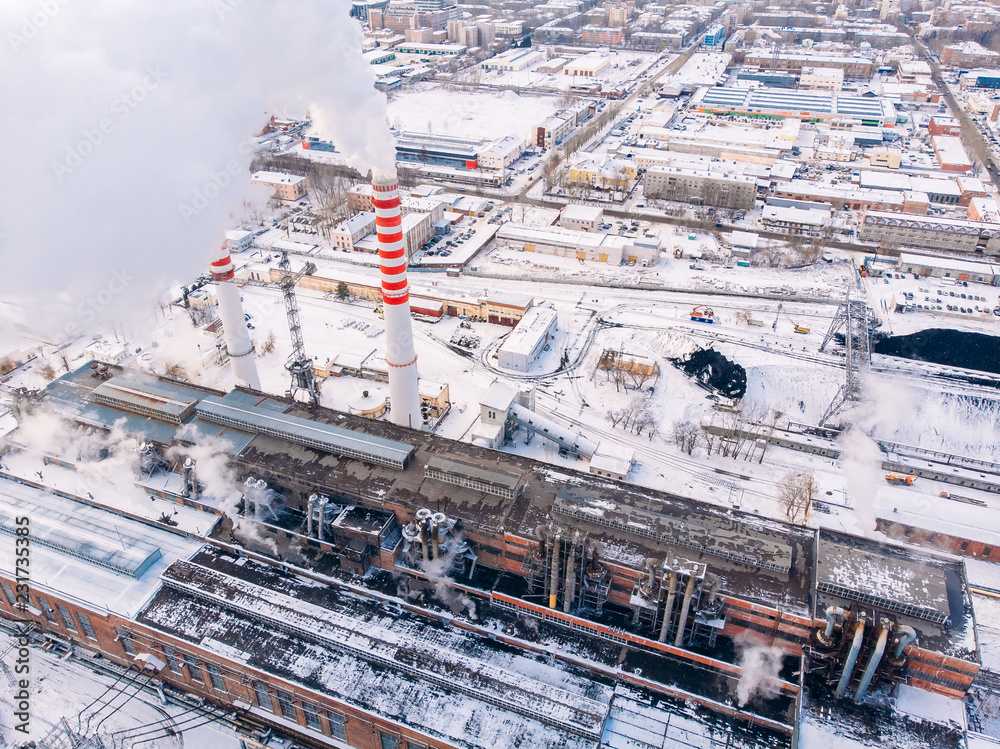 Aerial top view clouds of smoke and steam cooling tower industrial heat electro central coal.