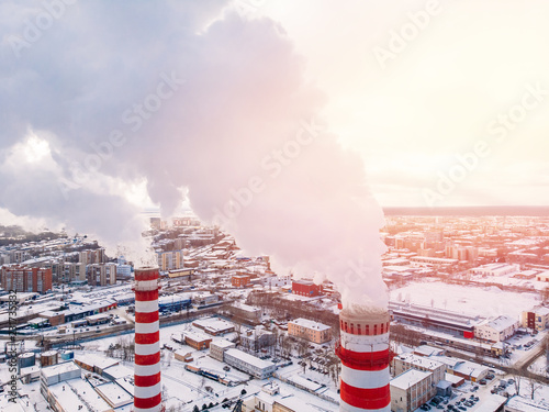 Aerial top view clouds of smoke and steam cooling tower industrial heat electro central coal. photo