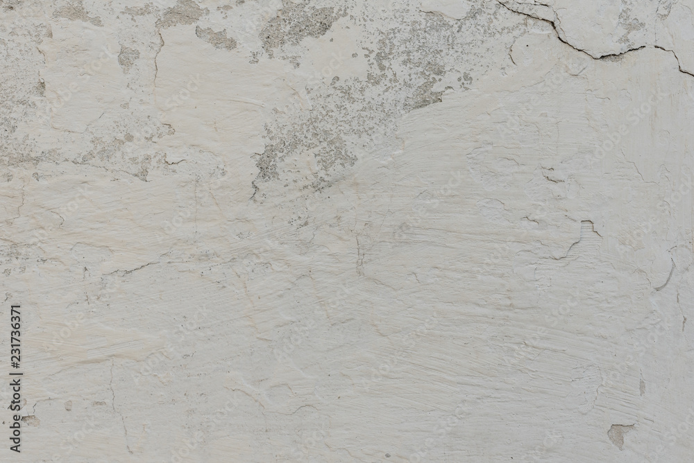 Fototapeta premium Wall fragment with scratches and cracks. It can be used as a background
