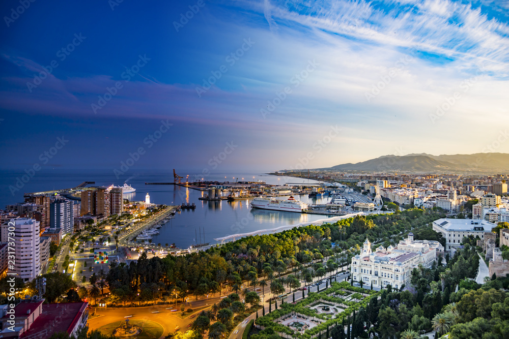 Obraz premium Night and day collage aerial view of Malaga city golden and blue hour