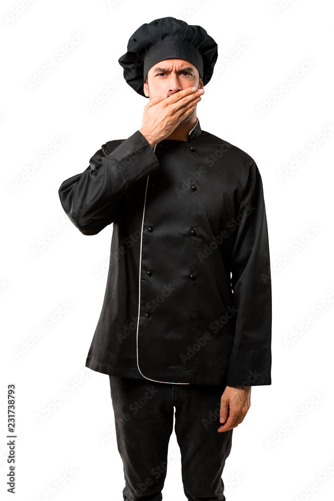 Chef man In black uniform covering mouth with hands for saying something inappropriate. Can not speak on isolated white background Chef man In black uniform covering mouth with hands for saying something inappropriate. Can not speak on isolated white background