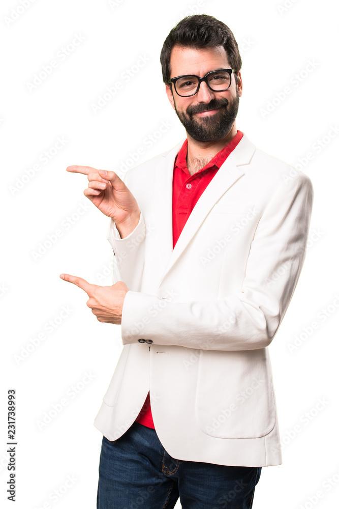 Brunette man with glasses pointing to the lateral on white background Brunette man with glasses pointing to the lateral on white background