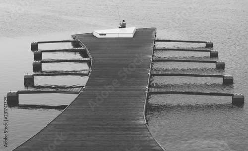 angler siting on the footbridge 