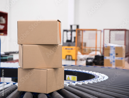 Packages and parcels delivery concept - cardboard box
