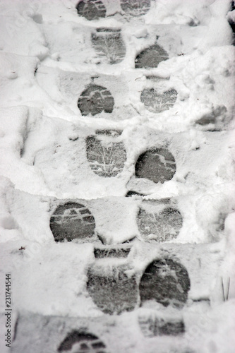 footprints on snowy stairs