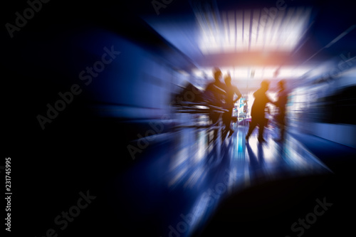 Silhouetted picture of man staff nurse assistant taking a patient lying on nursing bed to the doctor in a hurry with copy space. Background process with zoom out effect and radial sun lighting.