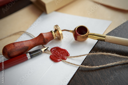 Old notarial wax seal on tied scroll,