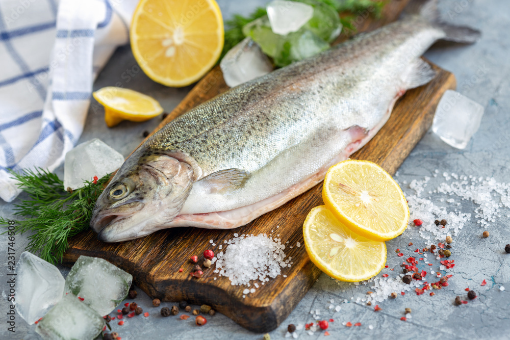 Preparation of trout, sliced lemon and green dill. Preparation of trout, sliced lemon and green dill.