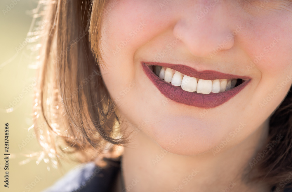 Beautiful girl with cherry red lips and white teeth is smiling Beautiful girl with cherry red lips and white teeth is smiling