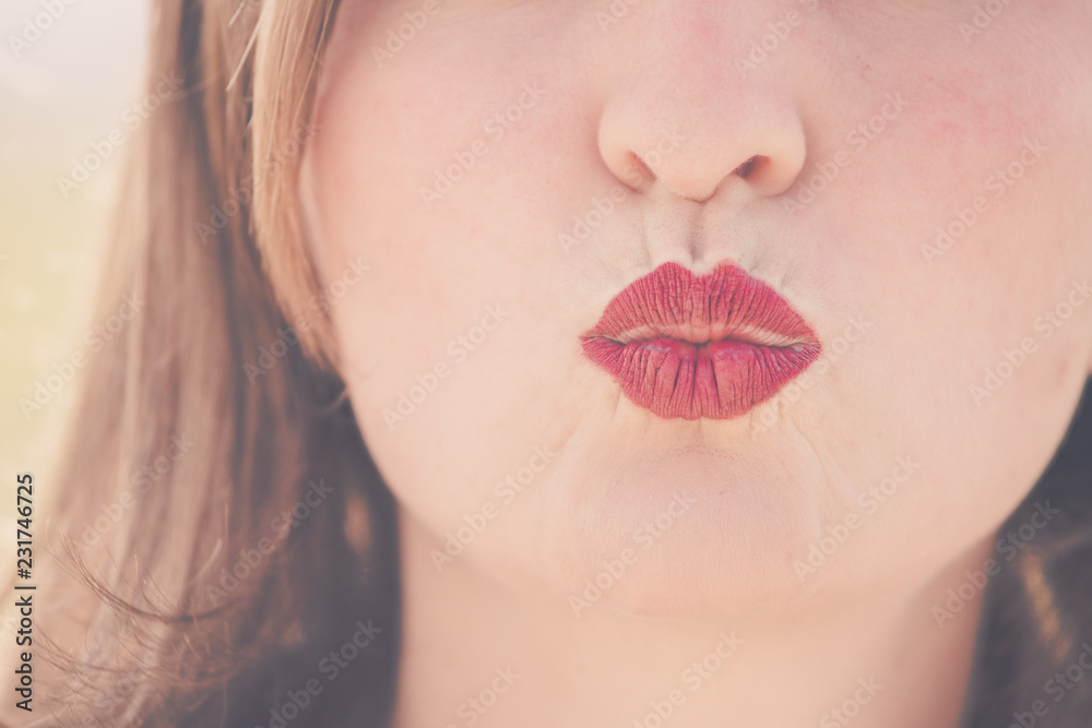 Cherry red lips of young girl are kissing Stock Photo Adobe Stock
