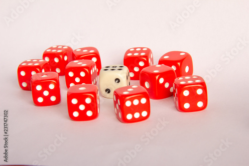 Dados rojos y dado blanco photo