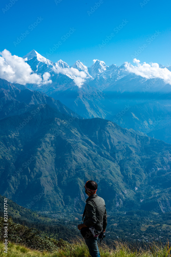 Trekker at Peak of Himalayas
