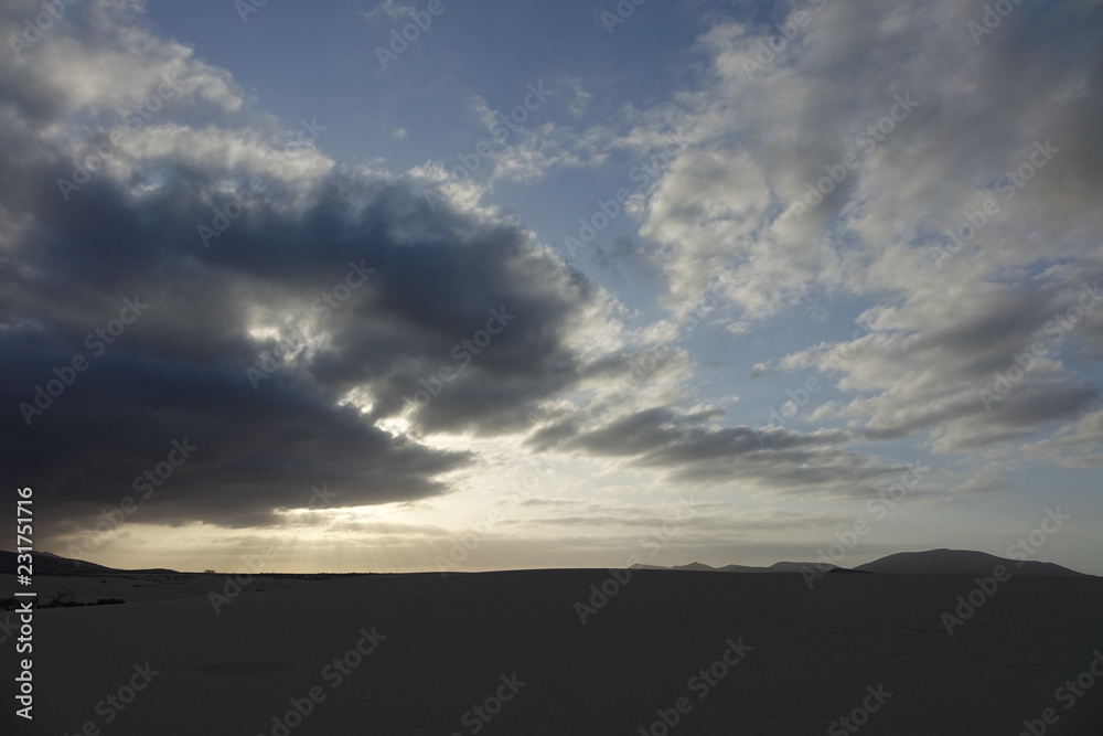 Sunset over the sand dunes in the Natural Park in Fuerteventura,Canary Islands,Spain. Sunset over the sand dunes in the Natural Park in Fuerteventura,Canary Islands,Spain.