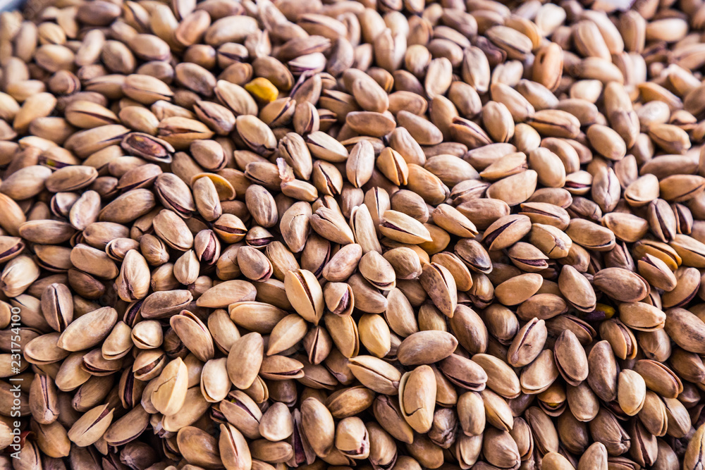 A mixture of nuts on the market. Various nuts in the store, juicy snacks sold in the market. Food for vegetarians. Ingredient for cooking and sweets. A mixture of nuts on the market. Various nuts in the store, juicy snacks sold in the market. Food for vegetarians. Ingredient for cooking and sweets.