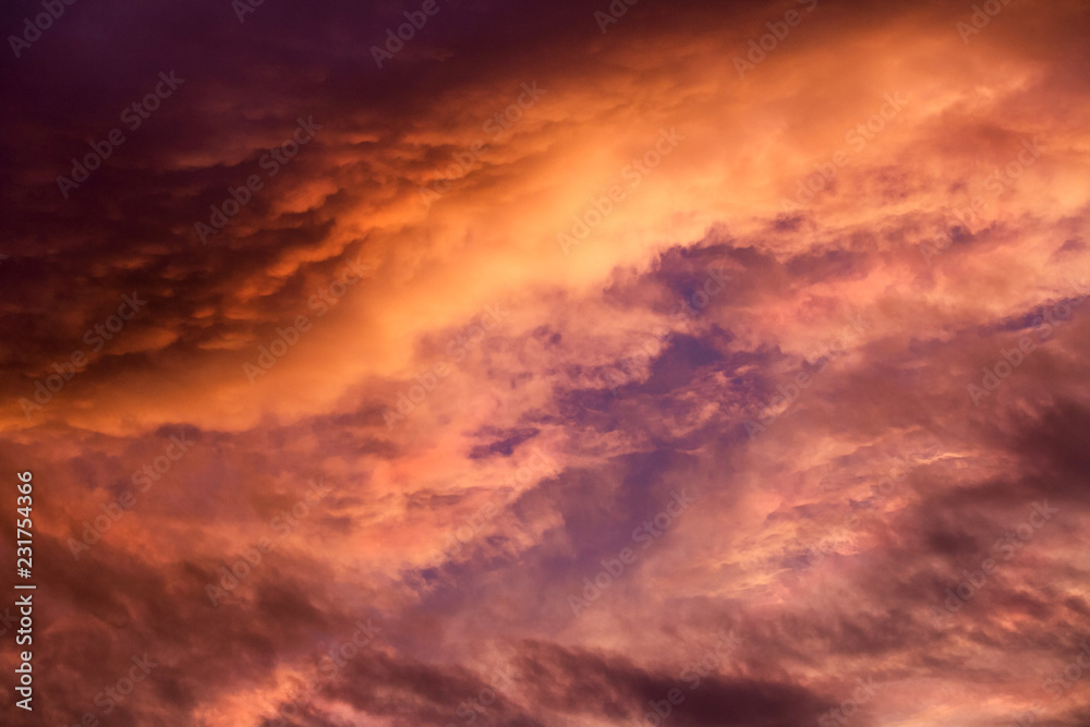 romantic sunset sky with golden clouds