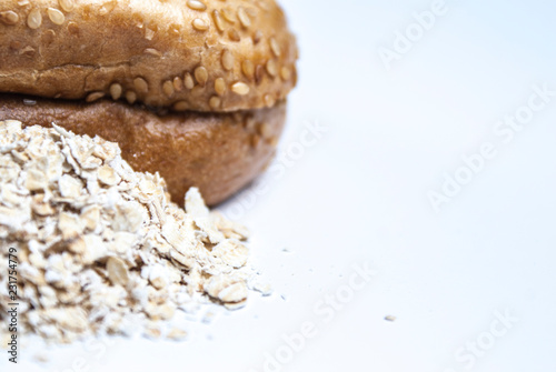 Fresh baked bagel with sesame and oat meal  photo