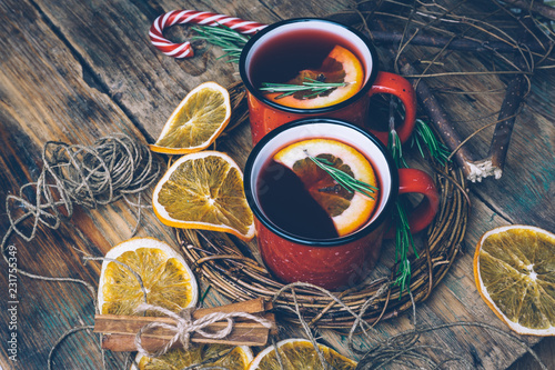 Christmas drink (winter hot drink). Mulled wine punch and spices for glintwine on vintage wooden table background top view. photo