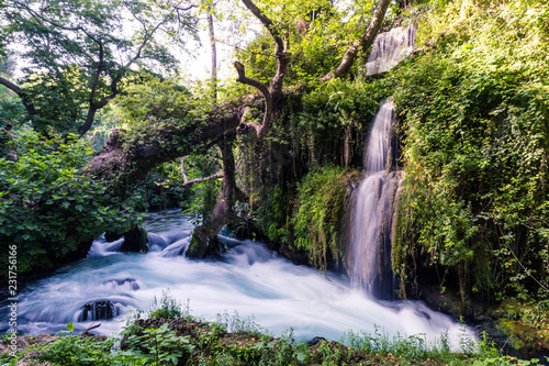 Great Duden Waterfalls is a beautiful tourist destination in Turkey near Antalya. Water falls from the rocks with trees and green grass. Water flows very quickly and gives freshness to nature. Good pl