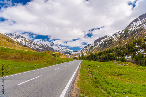 Road amoung snowy Alps mountains, Fluelapass, Davos, Graubuende