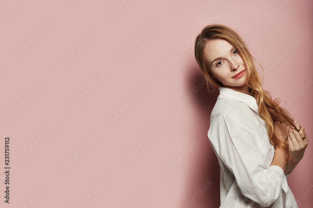 Pretty young woman posing on pink background Pretty young woman posing on pink background