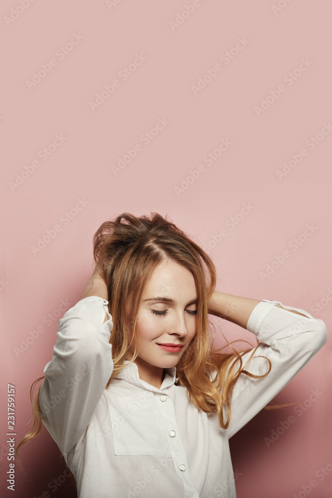 Pretty young woman posing on pink background Pretty young woman posing on pink background