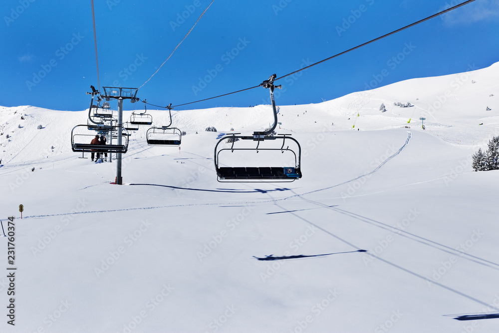 Line of chairlift in the mountains