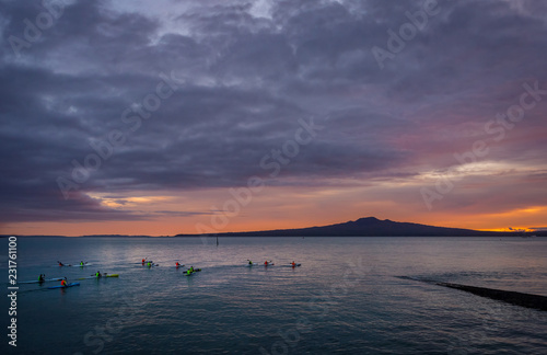 group kayaking in twilight