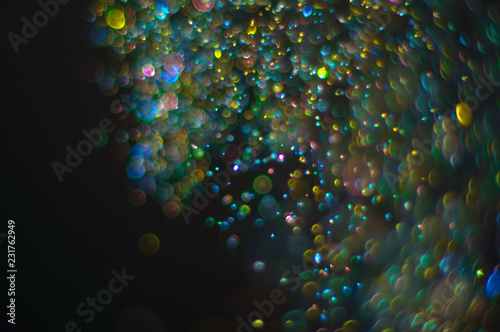 Abstract background with glittering defocused particles