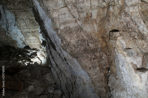 Cave wall Stone background texture. Underground dark cave