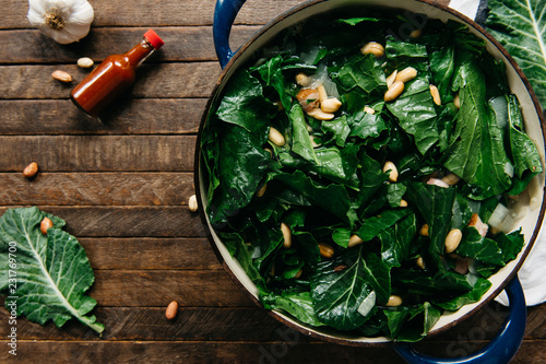 Collard greens with peanuts and hot sauce photo