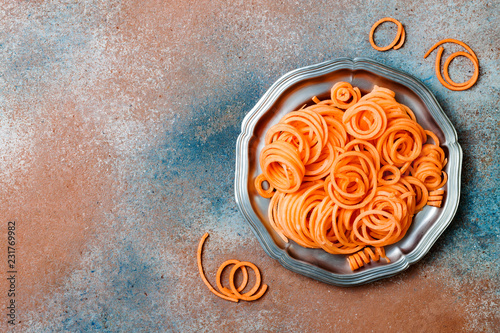 Spiralized sweet potato spaghetti. Low carb vegetable pasta cooking photo