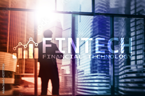 FINTECH - Financial technology, global business and information Internet communication technology. Skyscrapers background. Hi-tech business concept.