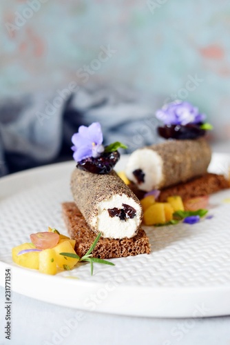 Toast from rye bread with cream cheese, dried plum and black pepper and fruit salsa from peach and mint. Snack, appetizer, catering. Homemade Crispbread toast with Cream Cheese