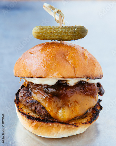 Cheeseburger with pickle photo